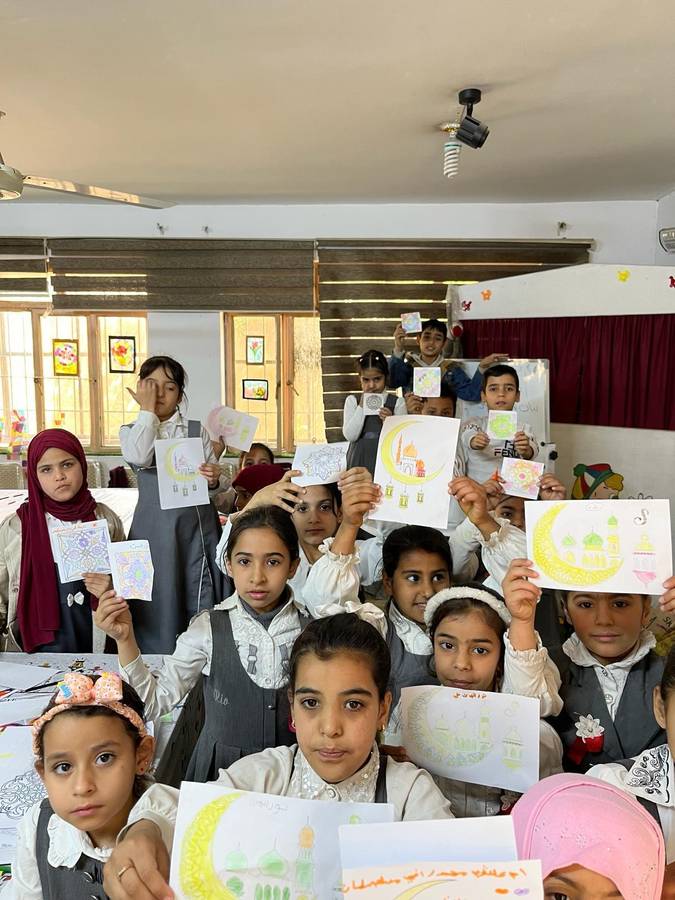 Young girls showing their drawings