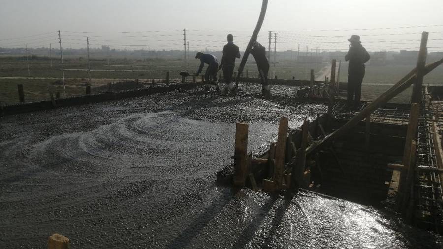 Concrete being poured for the homes built for widows and orphans north of Baghdad